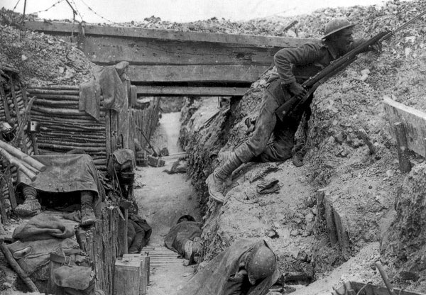 WWI soldier mans the trenches with his service-issued rifle and bayonet.